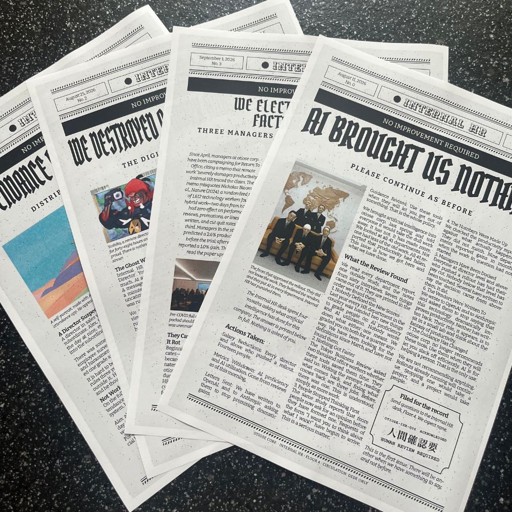 Internal HR bulletins fanned on a desk